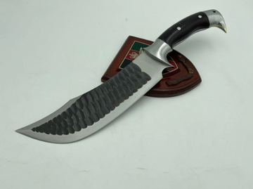 A 10 inch hand forged Bowie knife with a black and gray blade and a brown rosewood handle, displayed next to its scabbard.